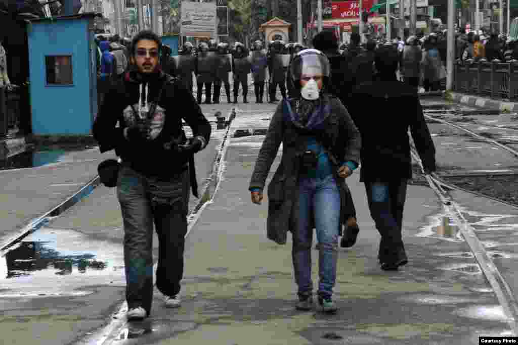 Amira Mortada and a colleague in the field after clashes broke out across Egypt in response to Morsi's ouster, August 2013. (Courtesy of Amira Mortada)