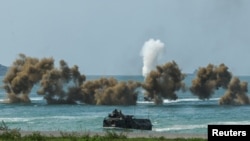 Smoke rises from an amphibious assault vehicles (AAV) participating in the &quot;Cobra Gold 2025&rdquo; (CG25) joint&nbsp;military&nbsp;exercise at a&nbsp;military&nbsp;base in Chonburi province,&nbsp;Thailand.