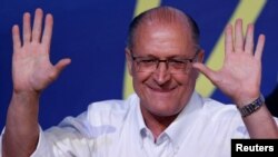 FILE - Sao Paulo's Governor Geraldo Alckmin gestures after he was elected leader of the Brazilian Social Democracy Party (PSDB) during their convention in Brasilia, Brazil, Dec. 9, 2017. 