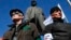 Activists stand guard during a pro-Russian rally at a central square in Donetsk, eastern Ukraine, March 23, 2014.