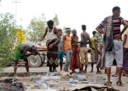 Ethiopian migrants gather on a pavement where they sleep in Aden, Yemen, June 15, 2020.