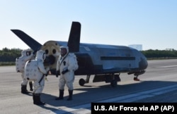FILE - This image provided by the U.S. Air Force shows the Air Force's X-37B spacecraft at NASA's Kennedy Space Center Shuttle Landing Facility in Cape Canaveral, Florida, May 7, 2017.