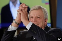 Hesse Prime Minister and Christian Democratic top candidate Volker Bouffier reacts to supporters at a party's election party after first results of the Hesse state election announced in Wiesbaden, Germany, Oct. 28, 2018.