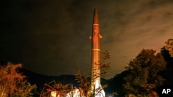 FILE - In this photo released by Xinhua News Agency, a missile from the rocket force of the Eastern Theater Command of the Chinese People's Liberation Army takes part in operations during the combat readiness patrol and military exercises around Taiwan on April 8, 2023. 