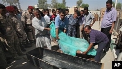 Body of slain Shiite pilgrim placed in a coffin in the holy city of Karbala, Iraq, Sept. 13, 2011 (file photo).