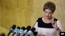 Brazil’s President Dilma Rousseff speaks with journalists after meeting with her lawyers regarding impeachment proceedings against her at Planalto presidential palace, in Brasilia, Brazil, Dec. 7, 2015.