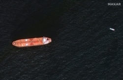 In this image provided by Maxar Technologies, the oil tanker Mercer Street is seen off the coast of Fujairah, United Arab Emirates, Aug. 4, 2021. The United States, United Kingdom and Israel blame Iran for an attack on the Mercer Street off Oman.
