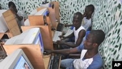 Ivorian youth checking an electoral commission website in a cyber cafe in Abidjan, Ivory Coast, on April 4, 2012.
