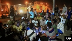 Sudanese protesters gather near military headquarters in the capital Khartoum, May 19, 2019, during an ongoing sit-in demanding a civilian-led government.