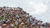 FILE - Rohingya refugees gather to mark the second anniversary of the exodus at the Kutupalong camp in Cox’s Bazar, Bangladesh, Aug. 25, 2019. 