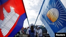 FILE - Supporters of the Cambodia National Rescue Party gather during a local election campaign in Phnom Penh, May 20, 2017. 