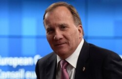 FILE - Sweden's Prime Minister Stefan Lofven leaves the European Council building at the end of an EU summit in Brussels, July 21, 2020.