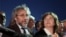 Journalist Can Dundar and his wife Dilek Dundar speak after his trial in Istanbul, late Friday, May 6, 2016. Dundar was sentenced to five years and 10 months in prison at the closed-door trial in Istanbul, while the paper's Ankara bureau chief Erdem Gul was sentenced to five years.
