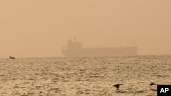 The oil tanker Mercer Street, which came under attack last week off Oman, is seen moored off Fujairah, United Arab Emirates, Aug. 4, 2021.