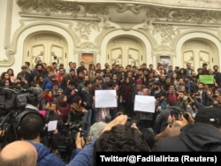 Tunisian activist speaks in front of anti-government protestors in Tunis, Tunisia, Jan. 10, 2018 in this picture taken from social media.