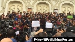 Tunisian activist speaks in front of anti-government protestors in Tunis, Tunisia, Jan. 10, 2018 in this picture taken from social media. 