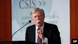 Former National Security Adviser John Bolton gestures while speaking at the Center for Strategic and International Studies in Washington, Sept. 30, 2019.