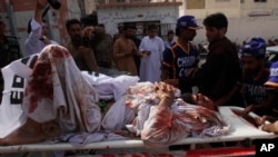 Pakistan volunteers rush an injured person to a hospital in Quetta, Pakistan, Aug. 16, 2019. 