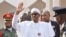 FILE - Nigeria President Muhammadu Buhari, waves after a meeting in Abuja, Nigeria, Jan. 9, 2017.