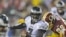 Vick Leads Eagles in Record-Setting NFL Rout of Redskins