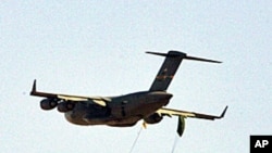 Egyptian and American paratroopers jump from an C-17 US transport in Kom Oshim near Fayyum, 90 km southwest of Cairo during the Bright Star war games coalition exercise, involving tactical air, ground, naval and special operations forces (File photo No