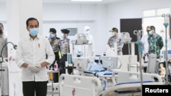 Indonesia's President Joko Widodo takes a look at the emergency hospital handling of COVID-19 in Kemayoran Athletes Village, to prevent the spread of coronavirus disease (COVID-19) in Jakarta, Indonesia March 23, 2020