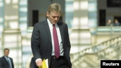 FILE - President Vladimir Putin's spokesman Dmitry Peskov is seen walking in Moscow April 17, 2014.