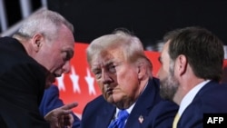 U.S. House Majority Leader Steve Scalise, left, speaks to former President Donald Trump and Republican vice presidential candidate J.D. Vance during the second day of the 2024 Republican National Convention at the Fiserv Forum in Milwaukee, Wisconsin, July 16, 2024. 