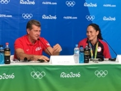 FILE - Coach Geno Auriemo and Sue Bird, captain of the U.S. women's Olympic basketball team, speak with reporters in Rio de Janeiro, Brazil, Aug. 20, 2016.