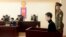 U.S. citizen Matthew Todd Miller (2nd R) sits in a witness box during his trial at the North Korean Supreme Court in Pyongyang, September 14, 2014.