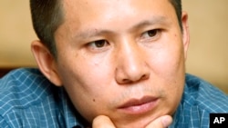 This July 17, 2009 file photo shows legal scholar Xu Zhiyong at a meeting in Beijing.
