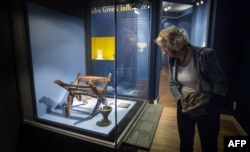 Netherlands -- A visitor looks at artefacts on display during the exhibition 'Crimea: Gold and Secrets of the Black Sea' at the Allard Pierson Museum in Amsterdam, August 21, 2014