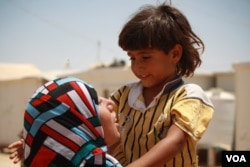 Just over a year old, Morhaf's brother, Rafaat, is malnourished because he can't eat or drink without getting sick, at the Za'atari camp in Jordan, June 17, 2015. (Photo: H. Murdock / VOA)