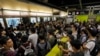 Pro-Democracy Protesters Block Train Service in Hong Kong