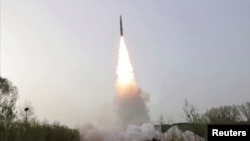 A view of a test launch of a new solid-fuel intercontinental ballistic missile (ICBM) Hwasong-18 at an undisclosed location in this still image of a photo used in a video released by North Korea's Korean Central News Agency (KCNA) April 14, 2023. KCNA via REUTERS TV/via REUTERS