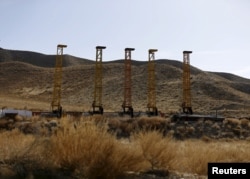 FILE - Equipment and machines are seen near a copper mine in Mes Aynak, Logar province, Feb. 14, 2015.