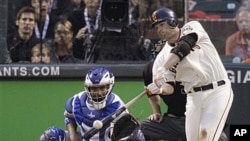 San Francisco Giants' Freddy Sanchez hits an RBI double to score Edgar Renteria in the third inning of Game 1 of baseball's World Series against the visiting Texas Rangers, 27 Oct 2010