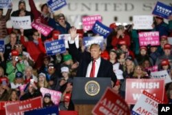 President Donald Trump speaks during a rally, Oct. 24, 2018, in Mosinee, Wisconsin..
