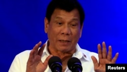 FILE - Philippine President Rodrigo Duterte delivers a speech during the 80th National Bureau of Investigation anniversary, Nov. 14, 2016. On Thursday Duterte said he might withdraw from the International Criminal Court. 
