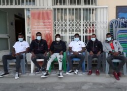 FILE - Ethiopian migrants who survived the Mozambique tragedy when 64 died in a metal container, are seen at the International Organization for Migration offices in Addis Ababa, Ethiopia, May 14, 2020.