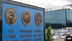 FILE - The sign outside the National Security Agency (NSA) campus in Fort Meade, Md., June 6, 2013. All fingers are pointing to Russia as author of the worst-ever hack of U.S. government agencies.