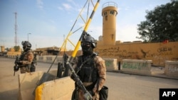 Iraqi counter-terrorism forces stand guard in front of the U.S. embassy in the capital Baghdad, Jan. 2, 2020.