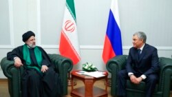 In this photo released by the Russian Federation Press Service, Iranian President Ebrahim Raisi, left, and Russian State Duma speaker Vyacheslav Volodin talk to each other during their meeting in Moscow, Jan. 20, 2022.