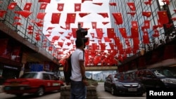 Chinese and Hong Kong flags are seen ahead of 20th anniversary of the handover from Britain to China, in Hong Kong, June 27, 2017.