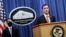 Acting Assistant Attorney General Brian Rabbitt, of the Justice Department's Criminal Division, and other officials speak at the Justice Department in Washington, Oct. 22, 2020.
