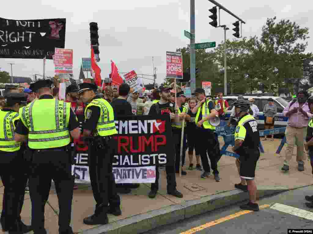 First clash with police. Counter-protestors stopped&nbsp; because of picket signs.