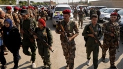 资料照片：叙利亚民主军战士在叙利亚东北的卡米什利镇为阵亡战友举行葬礼。(2019年10月22日)