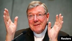 FILE - Cardinal George Pell talks during a news conference at the Vatican July 9, 2014.