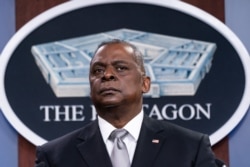 FILE - Secretary of Defense Lloyd Austin listens to a question as he speaks during a media briefing at the Pentagon, Feb. 19, 2021, in Washington.