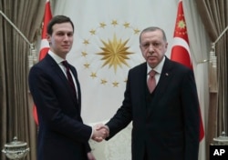 Turkey's President Recep Tayyip Erdogan shakes hands with Jared Kushner (L), U.S. President Donald Trump's adviser, prior to their meeting at the Presidential Palace in Ankara, Turkey, Feb. 27, 2019.